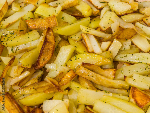 Potato fries, roasted, golden, and spiced