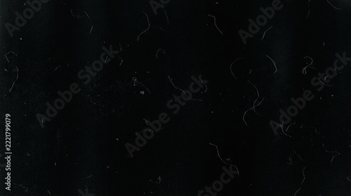 Vintage film texture with dust and scratches on black background