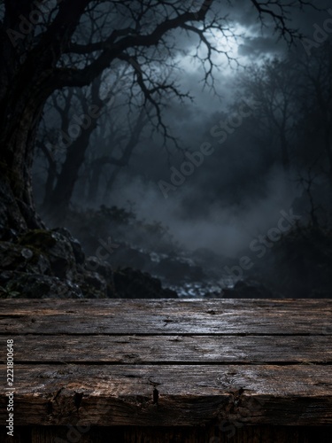 Empty Weathered Wooden Table against a Spooky Misty Halloween Forest