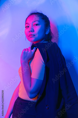 Woman in Pink Top and Black Blazer, Dramatic Neon Fashion Portrait