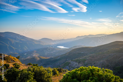 View on Embalse de Rules reservoir in Guadalfeo River valley around Orgiva, Sierra de Lujar and Sierra de la Contraviesa in Alpujarras region, Spain.