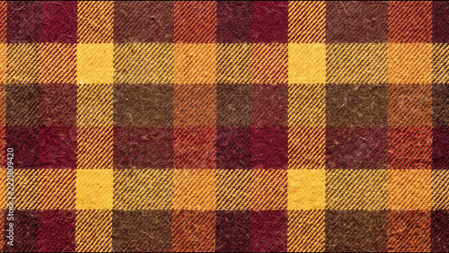 Vibrant multicolored woolen plaid fabric featuring yellow red and brown checks in autumn season