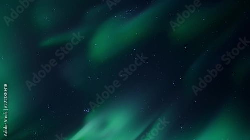Flowing green aurora borealis ribbons sweeping across starry night sky with soft undulating motion, deep navy background and scattered stars creating ethereal nocturnal landscape scene, panoramic view