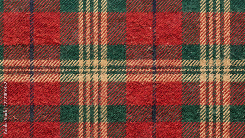 Traditional red and green tartan plaid woolen fabric textile pattern macro photography studio shot