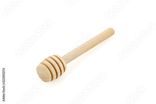 Wooden honey dipper isolated on a white background.