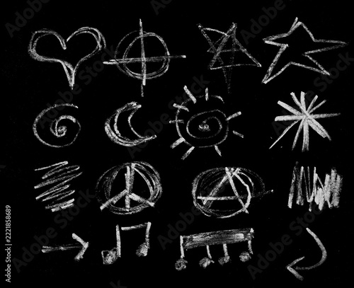 Hand drawn white chalk various symbols and doodles set on black background isolated illustration