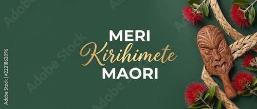 Meri Kirihimete New Zealand Christmas Maori greeting card with red pohutukawa flowers and traditional wood carving on dark green background celebrating festive holidays in Aotearoa with elegant joy.