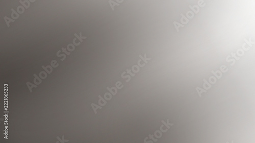 Smooth gradient background featuring soft blending monochromatic shades of gray, white, and subtle silver lighting effects