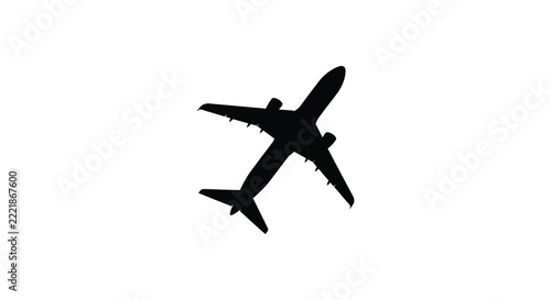Commercial airplane viewed from below black silhouette