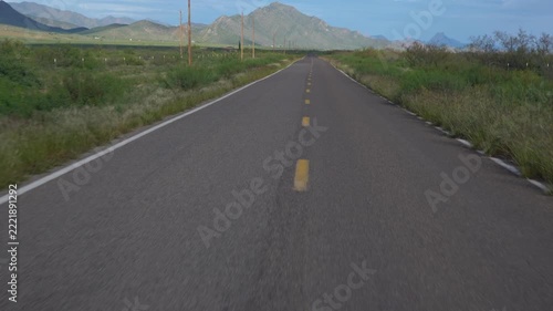 Drive POV on a desolate highway in the American southwest