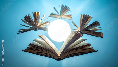 Open Book with Flying Pages and Light.