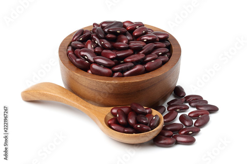 Red beans in a wooden bowl and a wooden spoon. isolated on a white background.