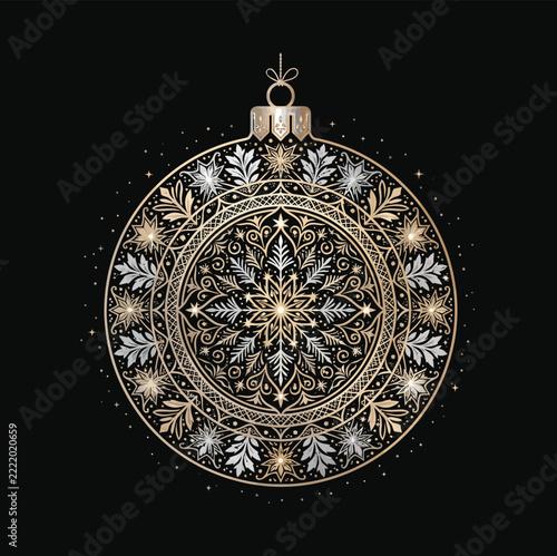 Intricate gold and silver christmas ornament with detailed snowflake patterns and floral filigree on a solid black background