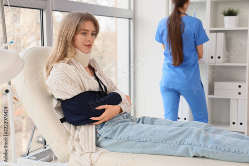 Medical recovery and rehabilitation, patient with neck brace and arm sling si...