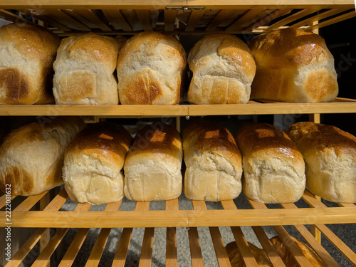 Freshly Baked Bread Loaves on Wooden Bakery Shelves Horizontal