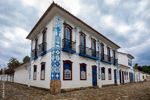Historic colonial building with blue and white facade on cobbled street in Paraty Brazil