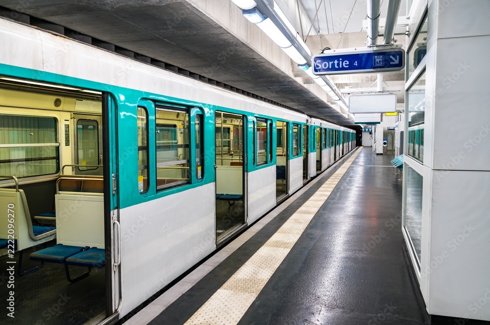 Fototapeta premium Train at Mairie d'Aubervilliers metro station in Paris, France on July 20, 2022.