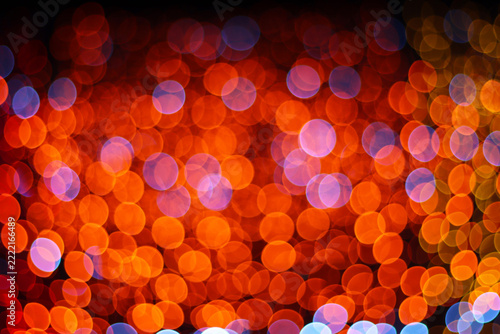 Orange and red bokeh lights abstract background for Christmas and festive night celebration
