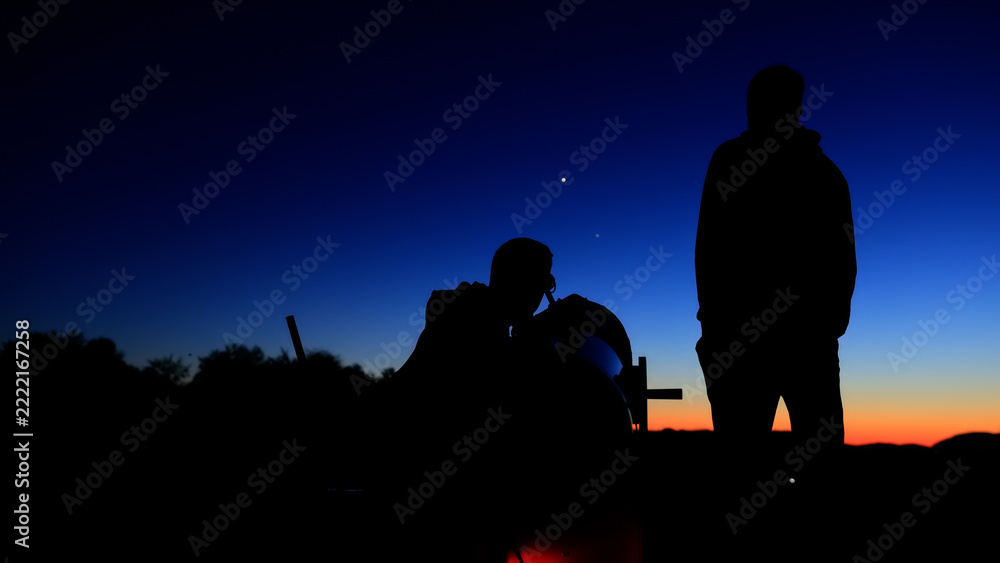 Fototapeta premium Amateur astronomers observing stars, planets, Moon and other celestial objects with a telescope in nature.