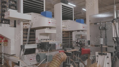 Automated routing process creates an interlocking joint for furniture manufacturing and wood assembly. CNC woodworking machine milling a precision edge profile on a wooden board.