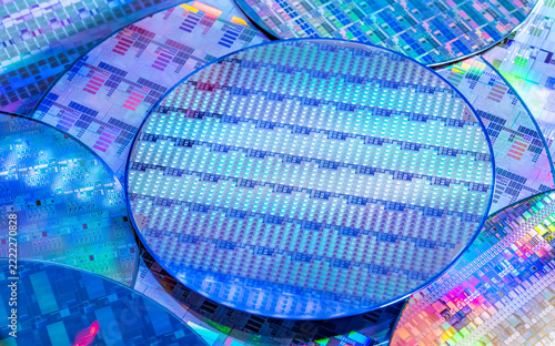 blue silicon wafer for manufacturing semiconductor of integrated circuit.Electronic circuit designs have been built onto the wafers using micromaching including photolithography