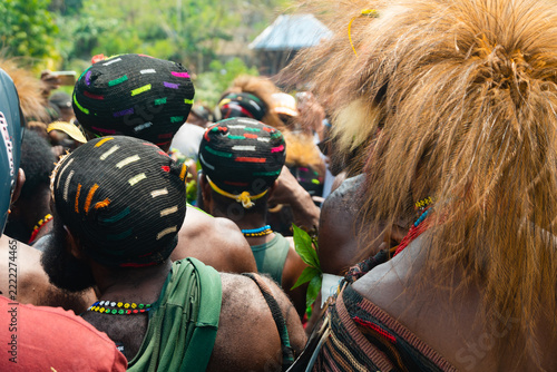 Fotografie Papua men with traditional handwoven hats and tribal cultural headdress