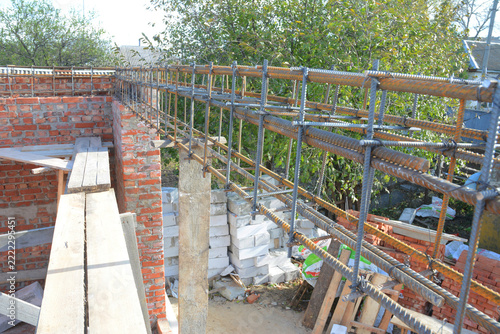 Exterior brick house construction with reinforced concrete lintel rebar