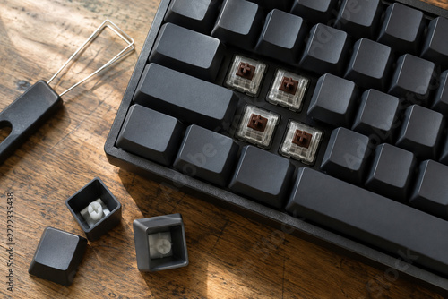 Modular keyboard parts on a workbench corner