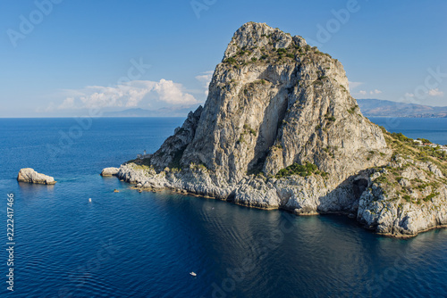 Aerial drone view of Cape Zafferano in Sicily, Italy, showing rugged rocky coastline of the Tyrrhenian Sea with crystal clear turquoise water, small islands and beautiful Mediterranean landscape.