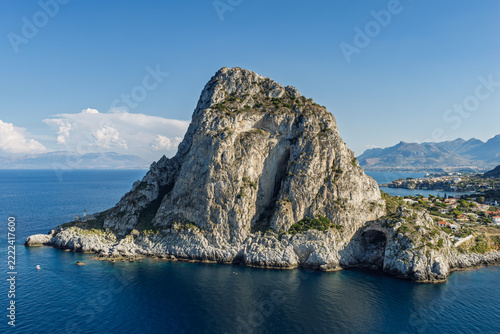 Aerial drone view of Cape Zafferano in Sicily, Italy, showing rugged rocky coastline of the Tyrrhenian Sea with crystal clear turquoise water, small islands and beautiful Mediterranean landscape.