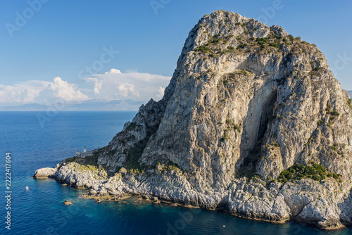 Aerial drone view of Cape Zafferano in Sicily, Italy, showing rugged rocky coastline of the Tyrrhenian Sea with crystal clear turquoise water, small islands and beautiful Mediterranean landscape.