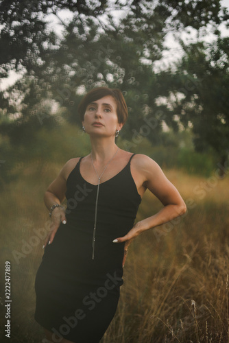 Beautiful Woman in a Rural Autumn Landscape at Sunset, Golden Hour Portrait and Countryside Lifestyle