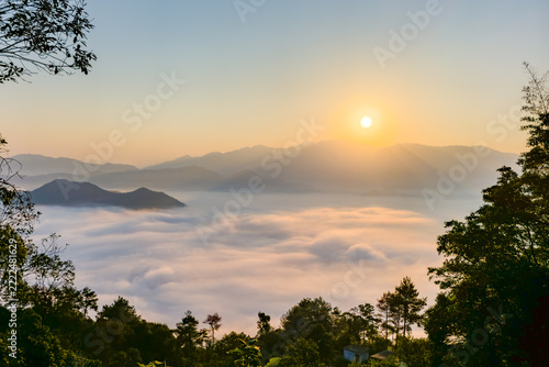 Sunrise over sea of clouds in mountains of rural Zhejiang, China, peaceful nature landscape