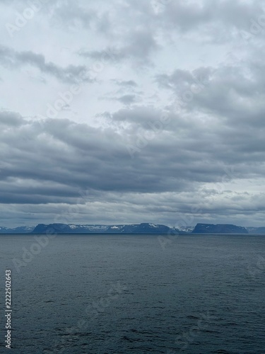 Approaching Iceland Coast Across Open Ocean Under Gray Sky