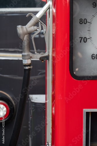 Vintage gas pump with a metal fuel nozzle