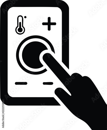 Hand adjusting temperature on a control panel