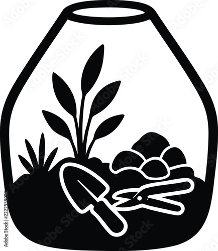 Terrarium with plants and gardening tools