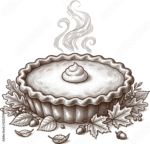 Hot pie with decorative crust and autumn leaves surrounding it  