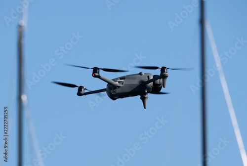 A drone flying near a small harbor