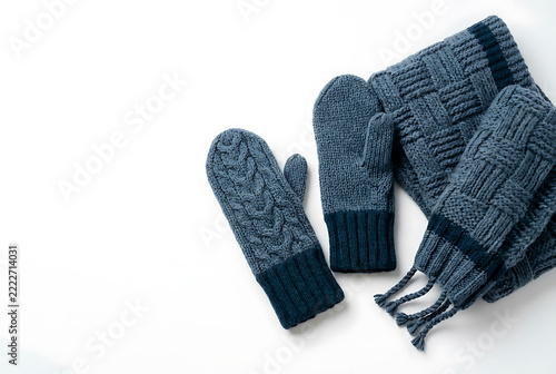 Blue knitted mittens and scarf for winter warmth