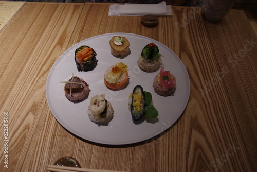Colorful temari sushi arranged on a white plate