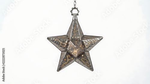 A beautiful metal star hanging from a chain on a white background
