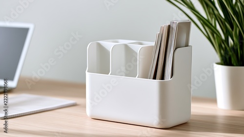 Minimalist white plastic desk organizer for stationery and office supplies.