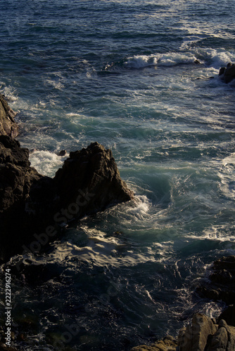 waves crashing on rocks