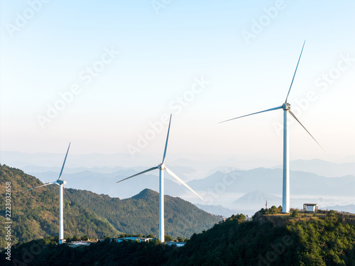 Fotografie wind turbines on mountain ridge generating clean energy