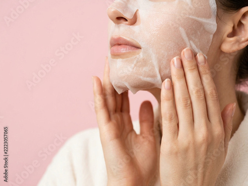 Woman applying face mask for skincare routine