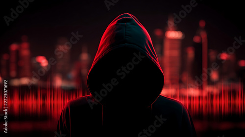 Mysterious Hooded Figure with Red Digital Lines and City Lights