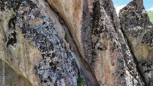 Two Wild Mountain Goats on Steep Rocky Cliffs in Türkiye
