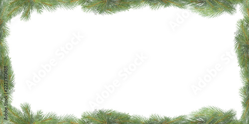Christmas pine branch frame on a green background with space for text.