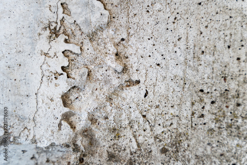 Weathered rough concrete texture background with cracks and blemishes